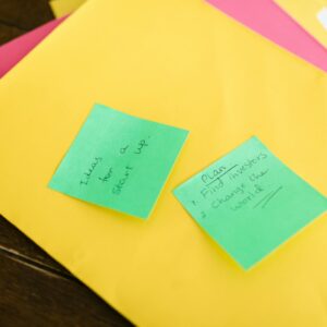 Vibrant sticky notes with startup ideas and plans placed on a desk.